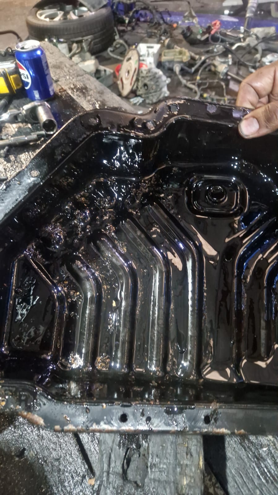 Oil pan contamination with sludge buildup
