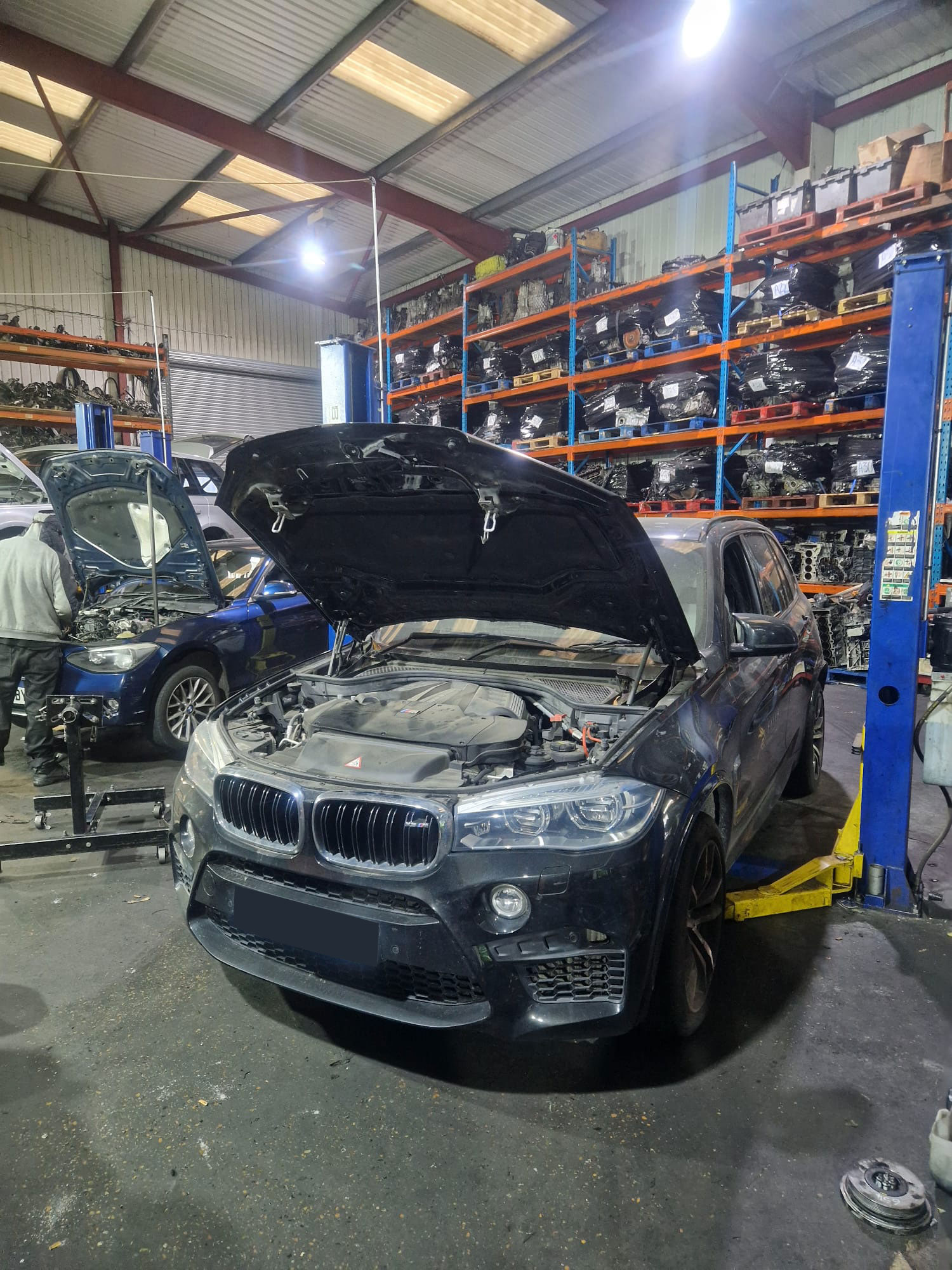 X5 M lifted in workshop