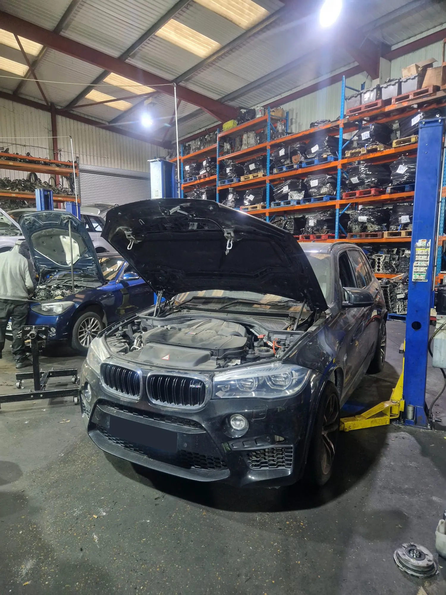 X5 M lifted in workshop