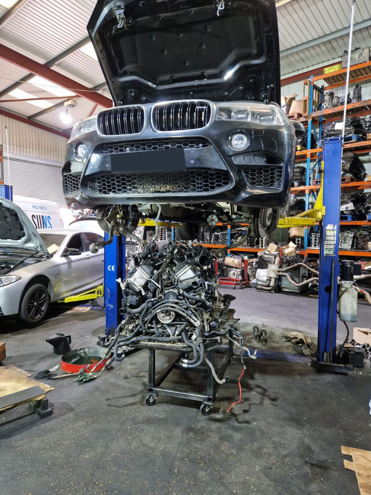 Engine detached below X5 M.