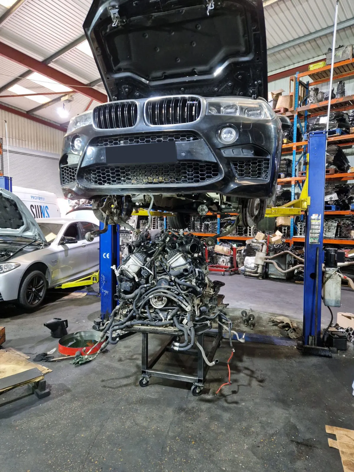 Engine detached below X5 M.